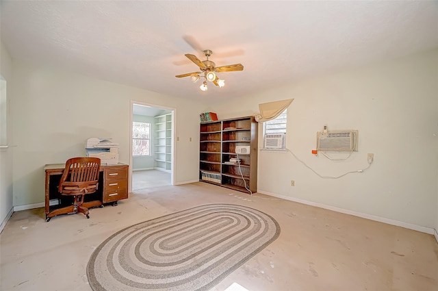 office space with a wall mounted AC and ceiling fan