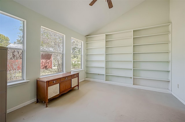 sunroom / solarium with plenty of natural light, lofted ceiling, and ceiling fan