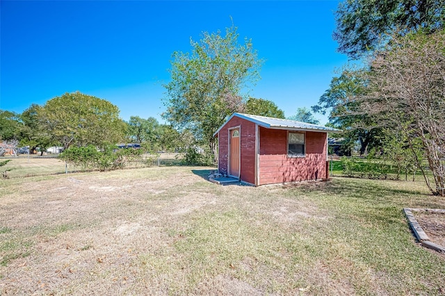 view of outdoor structure with a lawn