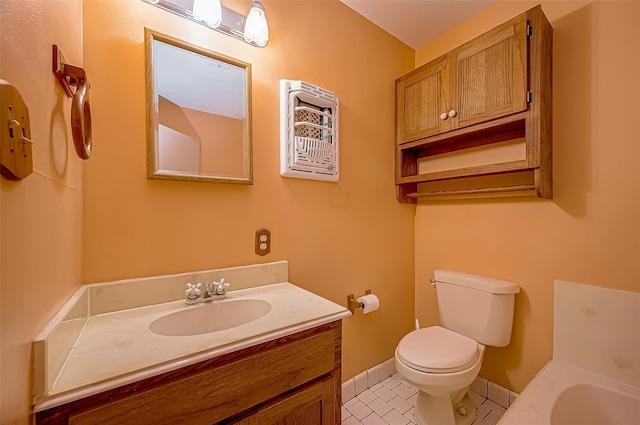 bathroom featuring tile patterned floors, vanity, and toilet