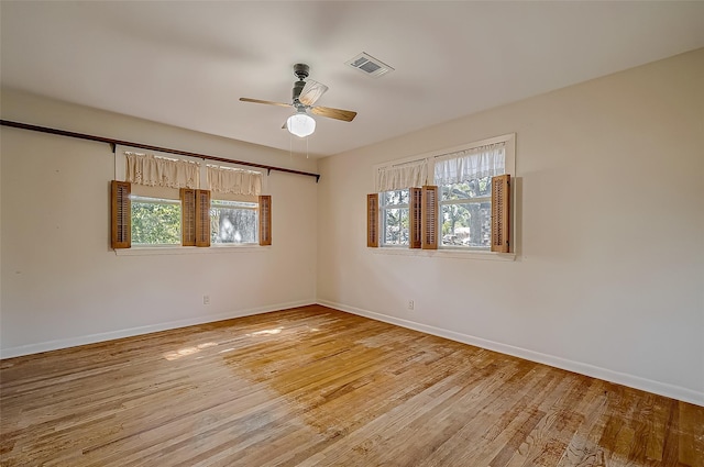 empty room featuring ceiling fan and light wood-type flooring