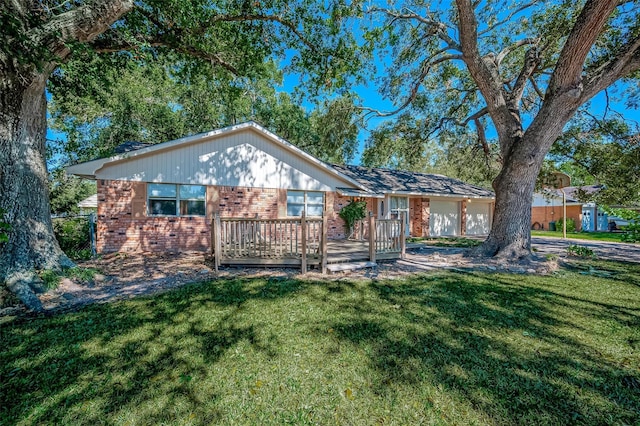 view of front of property with a front lawn and a deck