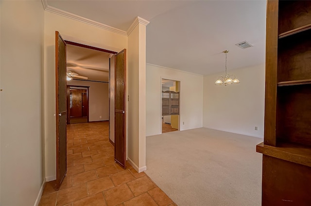 hall featuring light colored carpet, an inviting chandelier, and crown molding