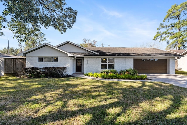 ranch-style house featuring a garage and a front yard