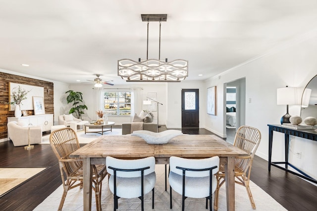 dining area with ceiling fan, dark hardwood / wood-style flooring, and crown molding