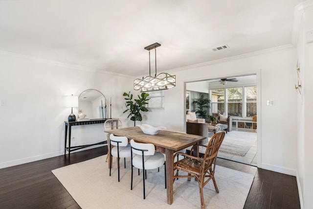 dining room with dark hardwood / wood-style floors, ceiling fan, and ornamental molding