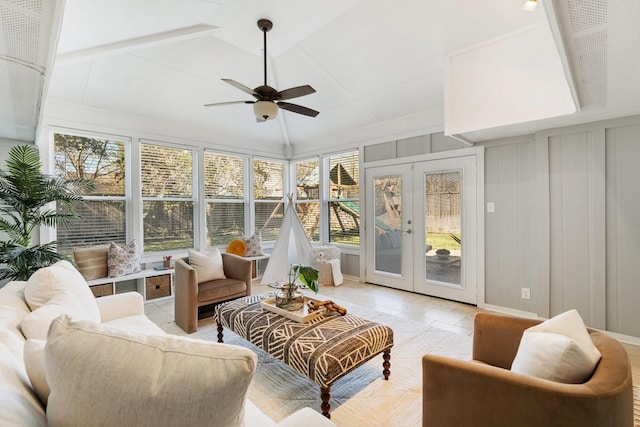 sunroom / solarium with french doors, plenty of natural light, and ceiling fan