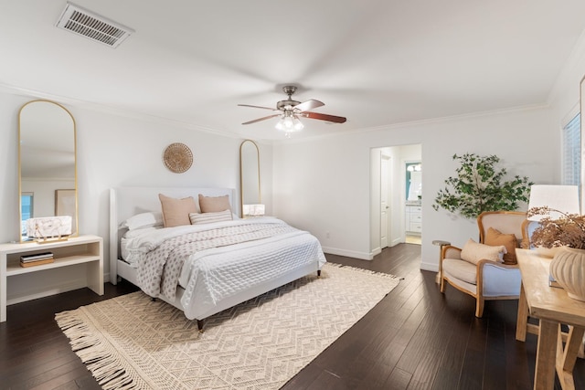 bedroom with dark hardwood / wood-style flooring, ensuite bathroom, ceiling fan, and crown molding