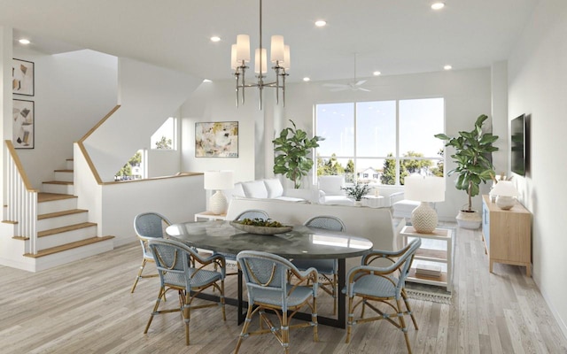 dining room with an inviting chandelier and light hardwood / wood-style flooring