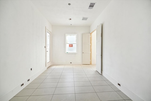 spare room with light tile patterned flooring