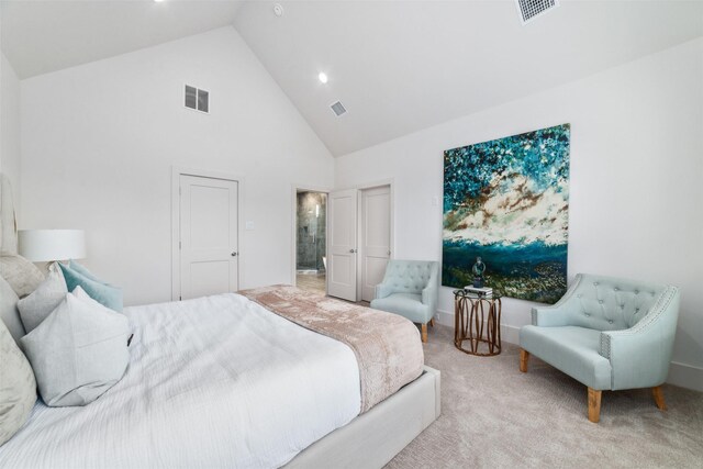 bedroom featuring light carpet and high vaulted ceiling