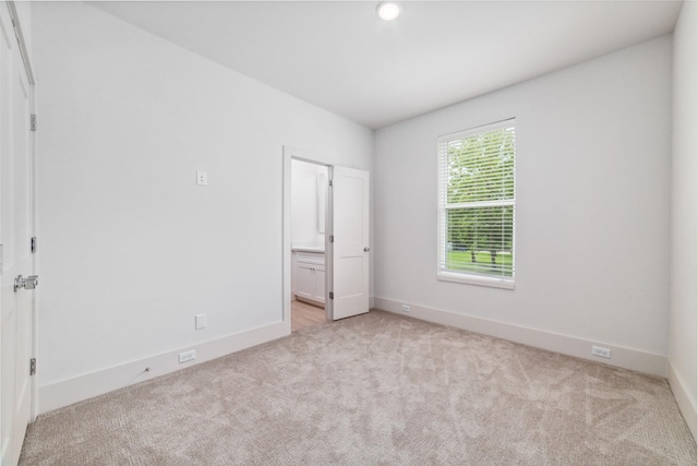 unfurnished bedroom with light carpet