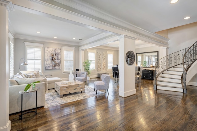 living room with decorative columns, ornamental molding, and dark hardwood / wood-style floors