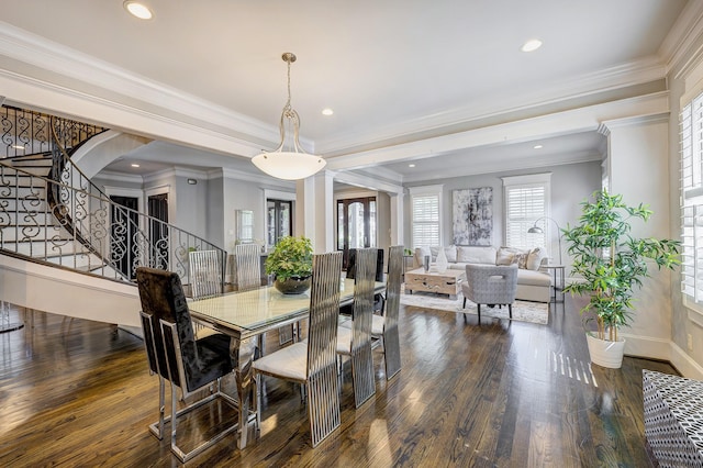 dining space featuring crown molding and dark wood-type flooring