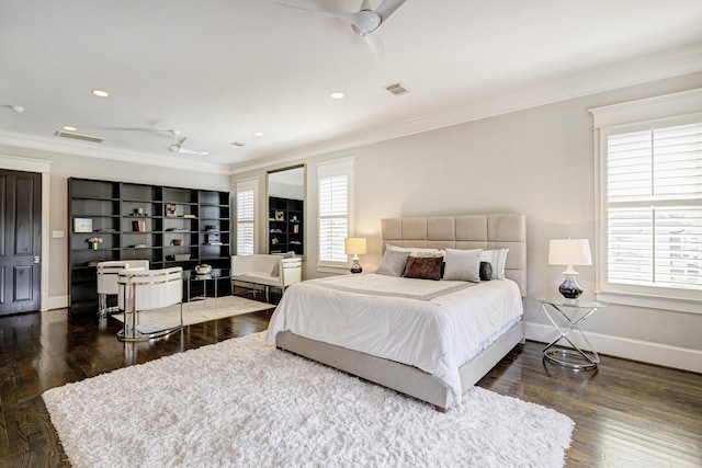 bedroom featuring crown molding, dark hardwood / wood-style floors, and ceiling fan