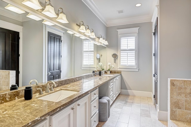 bathroom with ornamental molding, vanity, and tile patterned floors