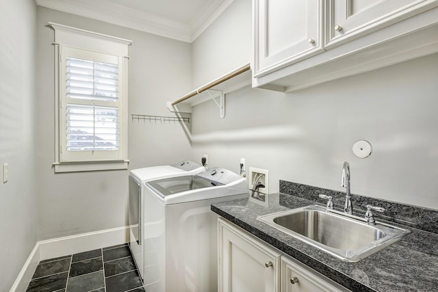 laundry area featuring cabinets, washing machine and clothes dryer, ornamental molding, and sink