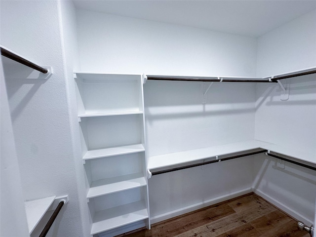 walk in closet featuring dark hardwood / wood-style flooring