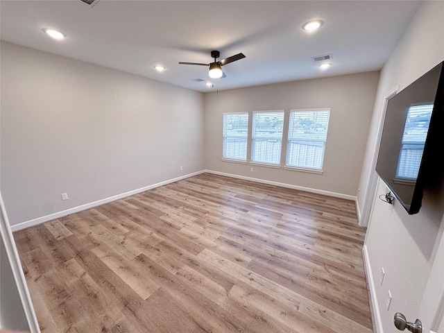 unfurnished room featuring ceiling fan and light hardwood / wood-style flooring