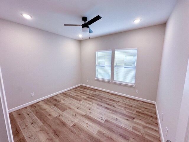 unfurnished room with ceiling fan and light hardwood / wood-style floors