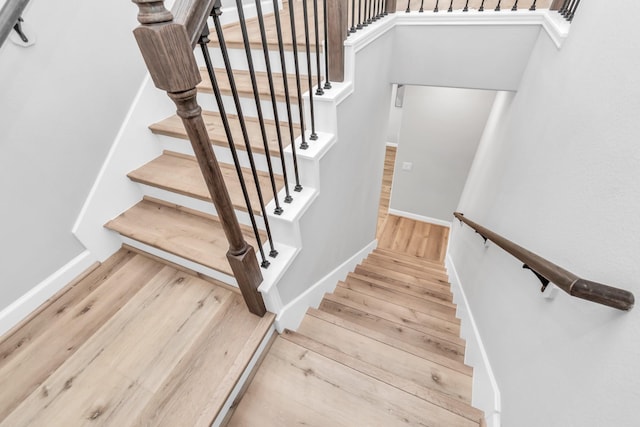 stairway with wood-type flooring