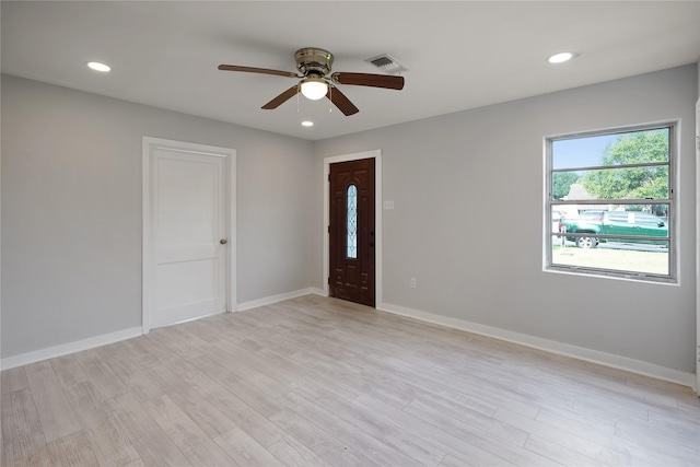 spare room featuring ceiling fan and light wood-type flooring