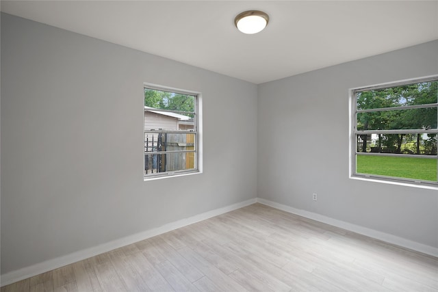 empty room with light wood-type flooring