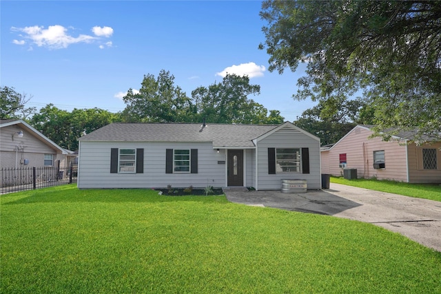 view of front of property featuring central air condition unit and a front lawn