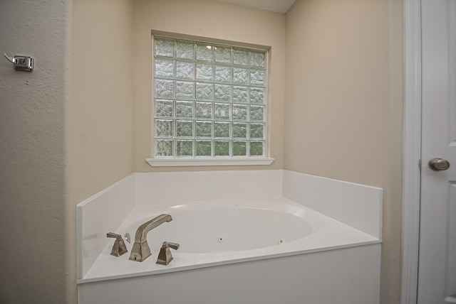 bathroom featuring a tub to relax in