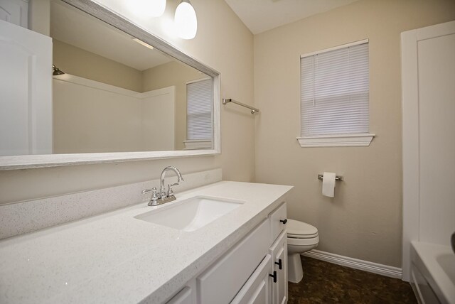 bathroom with vanity and toilet