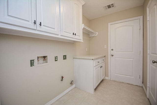 clothes washing area with electric dryer hookup, cabinets, hookup for a gas dryer, washer hookup, and light tile patterned flooring