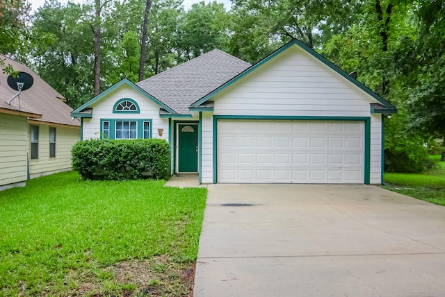 single story home with a front yard and a garage