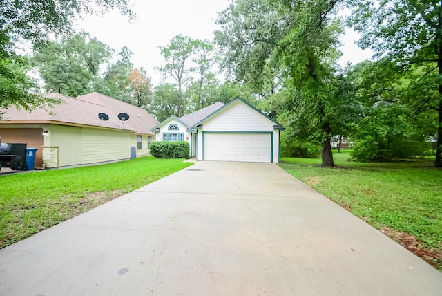 ranch-style home featuring a garage and a front lawn