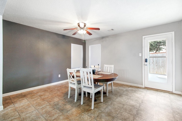 dining room featuring ceiling fan