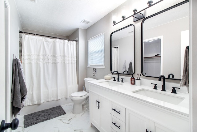 full bathroom featuring shower / tub combo, vanity, a textured ceiling, and toilet