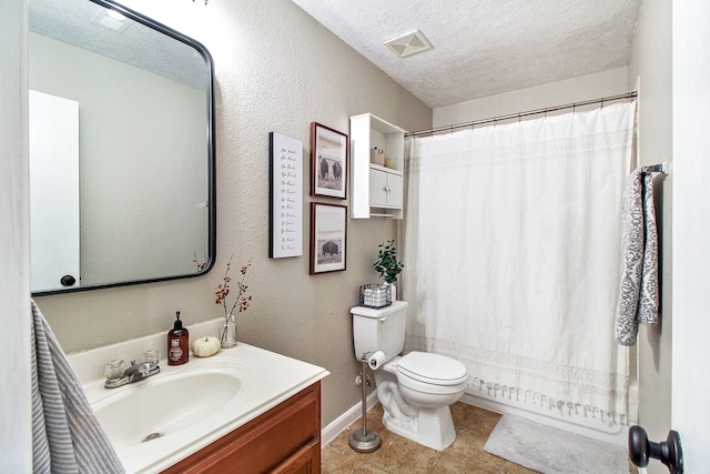 full bathroom featuring vanity, shower / bath combination with curtain, toilet, and a textured ceiling