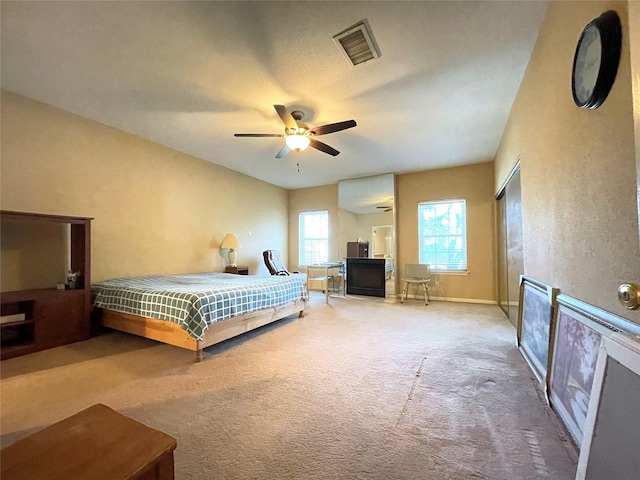 carpeted bedroom featuring ceiling fan