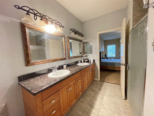 bathroom featuring vanity and an enclosed shower