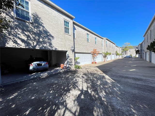 view of property exterior featuring a garage