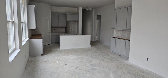 kitchen with gray cabinets and a kitchen island