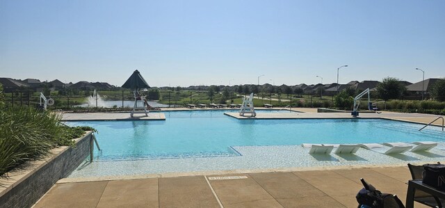 view of swimming pool with a patio area