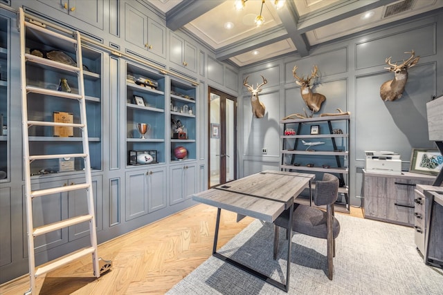 office area with beamed ceiling, light parquet flooring, coffered ceiling, and crown molding