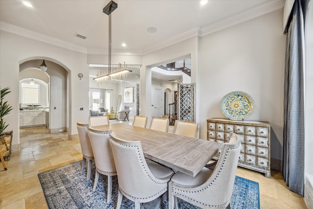 dining area with crown molding