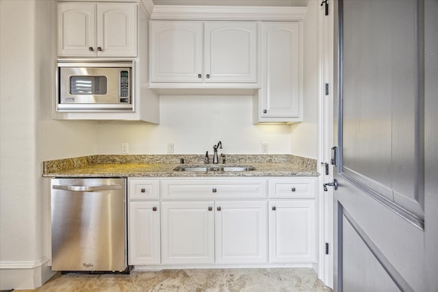 kitchen with white cabinetry, sink, stainless steel appliances, and stone counters