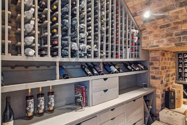 wine area featuring lofted ceiling