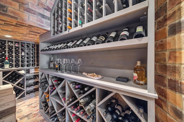 wine area featuring brick ceiling