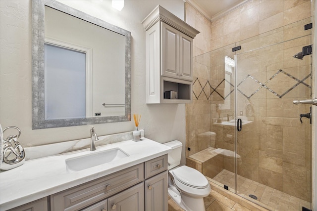 bathroom with an enclosed shower, vanity, crown molding, and toilet