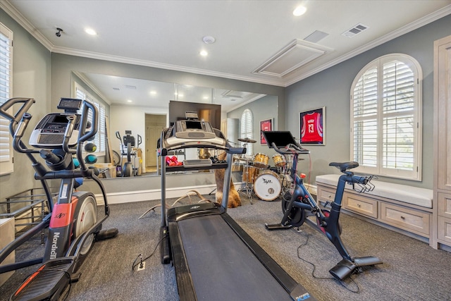 workout area featuring crown molding