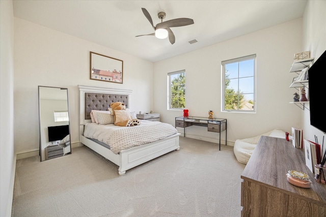 bedroom with ceiling fan and carpet floors