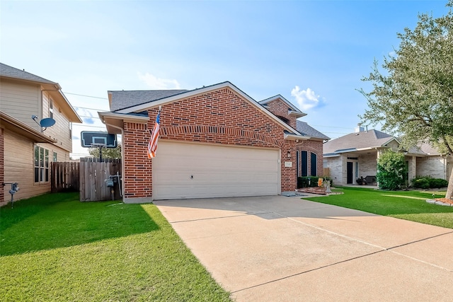 view of front facade with a front yard and a garage